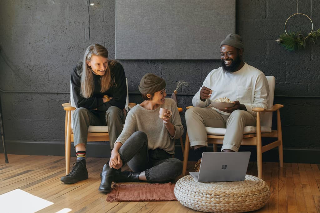 Three coworkers laughing